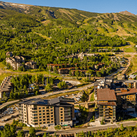 Limelight hotel with green slopes in background