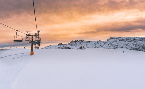 a ski lift in the snow