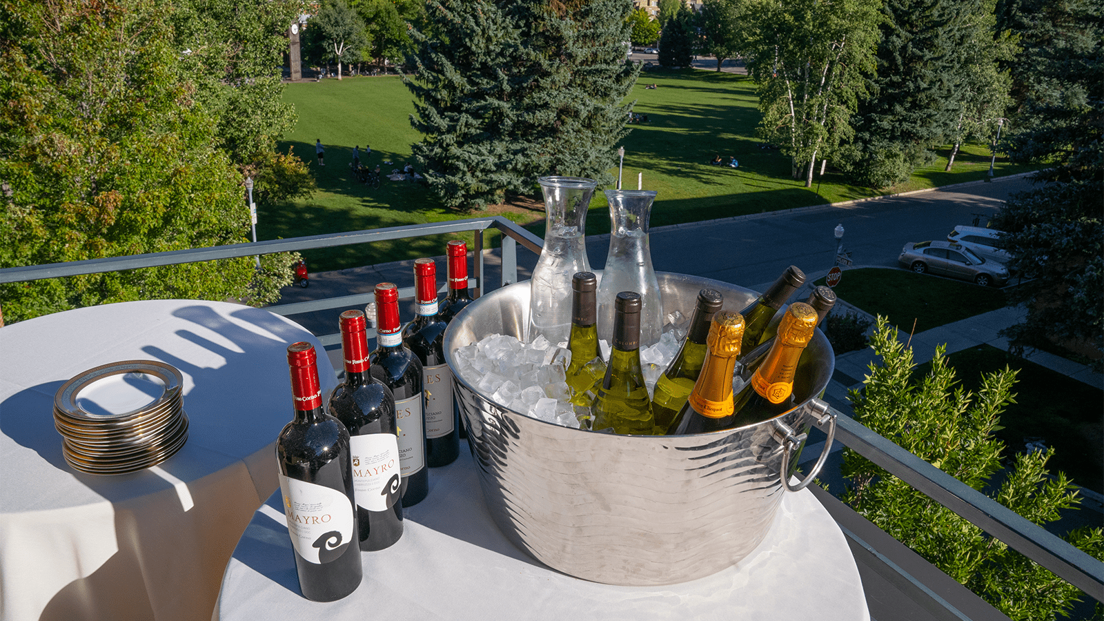 An assortment of beverages on the porch of the Limelight Aspen, for a rehearsal wedding