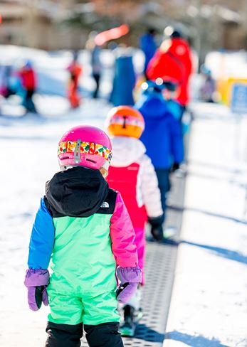 Kids in a line at ski school
