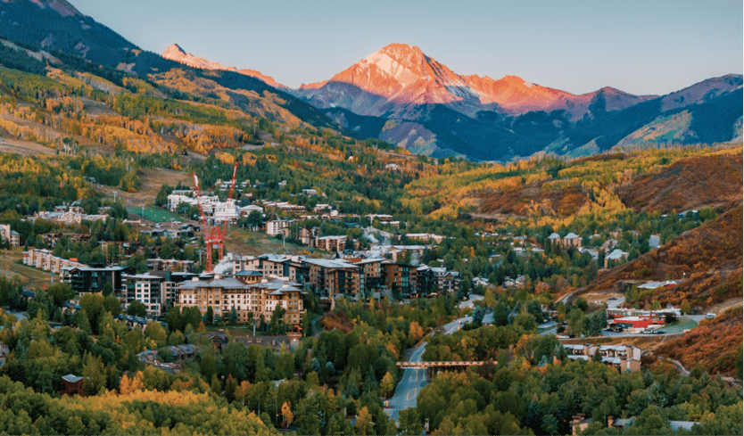Fall in snowmass mountain, sun sets over yellow and orange tree
